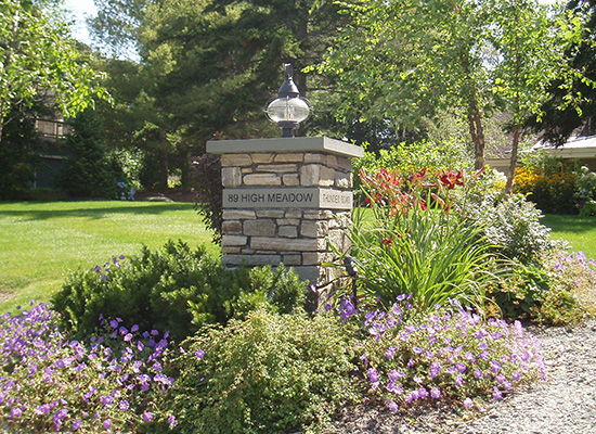 Picture of stone driveway parker with lantern and garden