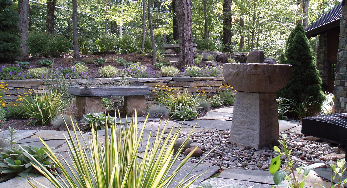Stone, walls, bench, patio & landscape plantings