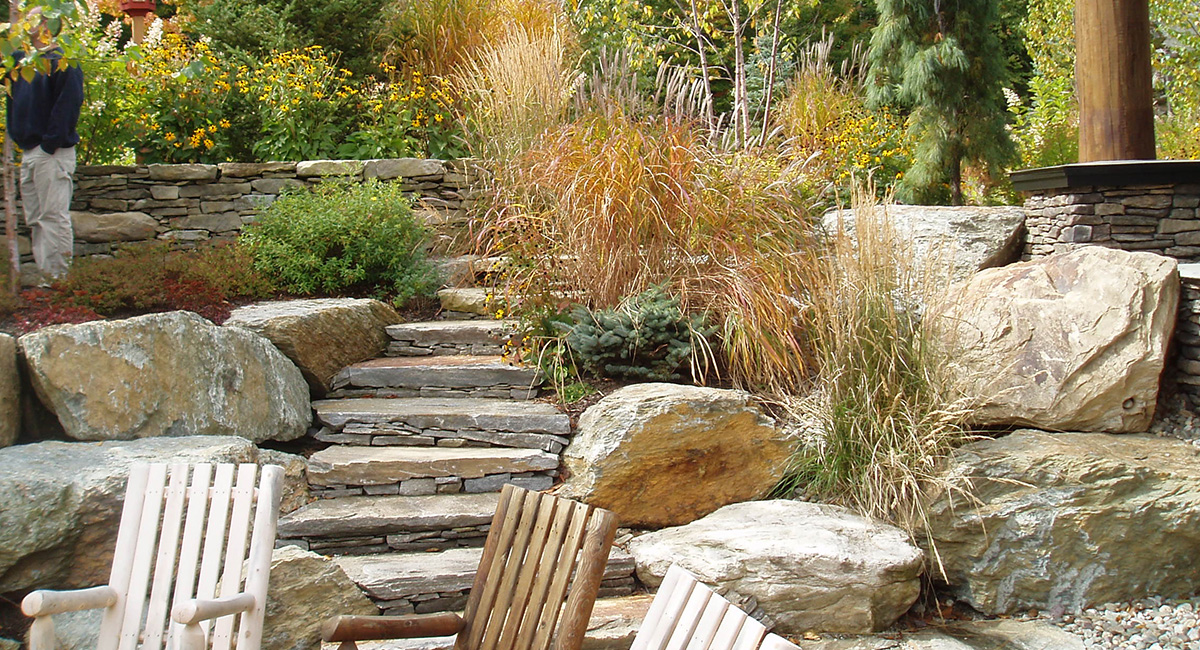 Stone stairs, boulder walls & landscape plantings